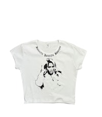 a white cropped t - shirt with an image of a woman